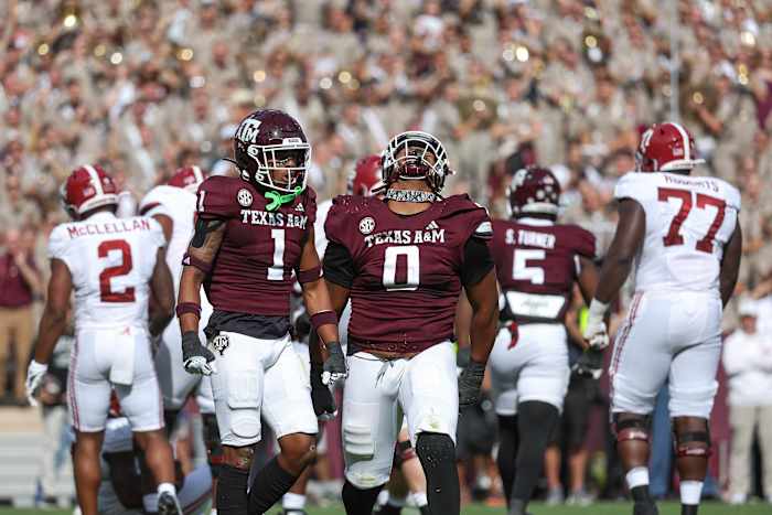 Texas A&M Aggies defensive lineman Walter Nolen (No. 0) celebrates a sack against Alabama Crismon Tide quarterback Jalen Milroe (No. 4) during the third quarter.